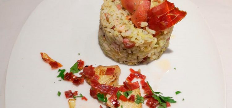 Café Bar Rick´s > Timbal de arroz con papada, alcachofa y jamón